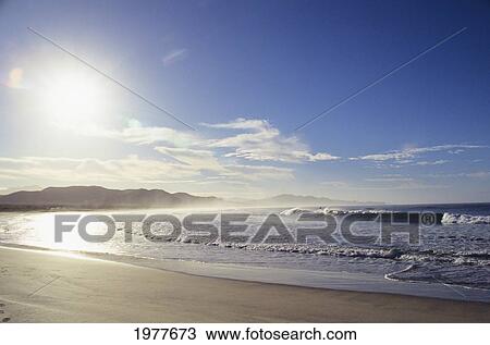 Stock Image - Mexico, Sunshine on coastline at popular surf spot; Los Cerritos beach. Fotosearch