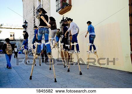 Mexico; Teenage Girls Walking On Stilts On Street View Large Photo Image Stock Image - Mexico; Teenage Girls Walking On Stilts On Street. Fotosearch