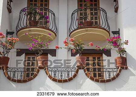 Mexico, Wrought iron decorations and flower pots; Puerto Vallarta View Large Photo Image Stock Photo - Mexico, Wrought iron decorations and flower pots; Puerto Vallarta. Fotosearch