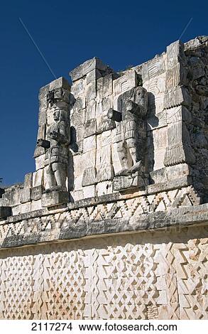 Picture - Mexico, Yucatan, Kabah, back side of the Palace of Masks, the unusual restore Atlantes (stone carved male figures). Fotosearch