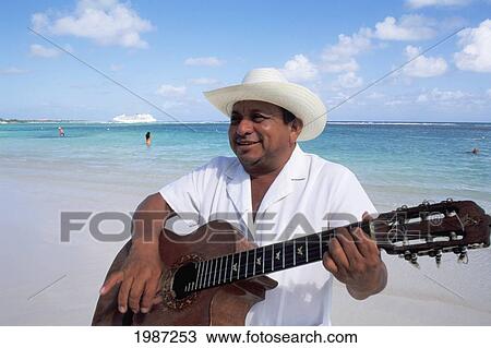 Stock Image - Mexico, Yucatan Peninsula, Costa Maya, Mariachi Guitar Player On Beach.. Fotosearch