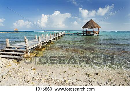 Stock Image - Mexico, Yucatan Peninsula, Tulum, Pier Over Turquoise Ocean.. Fotosearch