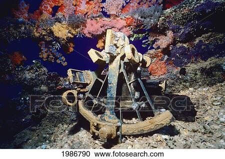 Stock Image - Micronesia, Colorful coral and rusty metal; Truk Lagoon, World War II shipwreck Shinkoku Maru. Fotosearch