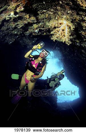 Stock Photo - Micronesia, Palau, Divers Entering A Cavern.. Fotosearch