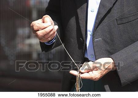 Stock Photo - Mid Section Of An Old Muslim Man With His Prayer Beads, Sarajevo, Bosnia And Herzegovina. Fotosearch
