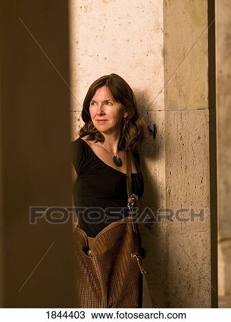 Middle-Aged Woman Leaning Against Column; Rome, Italy View Large Photo Image Stock Image - Middle-Aged Woman Leaning Against Column; Rome, Italy. Fotosearch