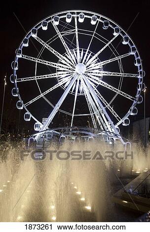 Stock Image - Middlesbrough, North Yorkshire, England; A Ferris Wheel And Fountains Illuminated At Night. Fotosearch