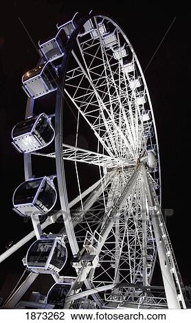 Stock Image - Middlesbrough, North Yorkshire, England; A Ferris Wheel Illuminated At Night. Fotosearch