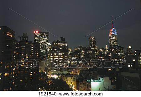 Stock Image - Midtown Manhattan Skyline At Night. Fotosearch