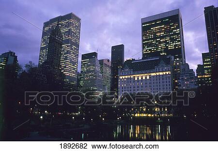 Stock Image - Midtown Manhattan Viewed From South Central Park At Dusk. Fotosearch