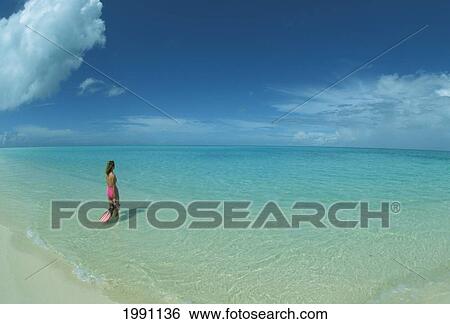 Midway Atoll, Woman In Pink Stands In Turquoise Water With Snorkel Gear, Blue Sky View Large Photo Image Stock Photograph - Midway Atoll, Woman In Pink Stands In Turquoise Water With Snorkel Gear, Blue Sky. Fotosearch