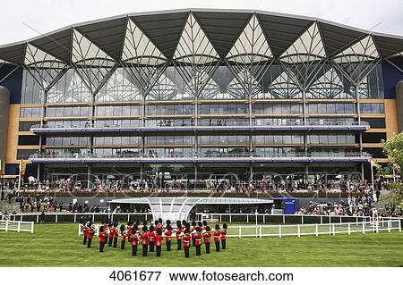 Stock Photo - Military band playing National Anthem prior to Royal procession at the Parade Ring with new Enclosure stand at the Royal Ascot horse race meeting; Ascot, Berkshire, England. Fotosearch
