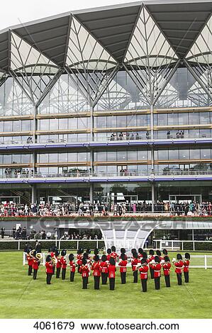 Stock Photo - Military band playing national anthem prior to Royal procession at the Parade Ring with new Enclosure stand at the world's best flat horse racing meeting, Royal Ascot; Ascot, Berkshire, England. Fotosearch