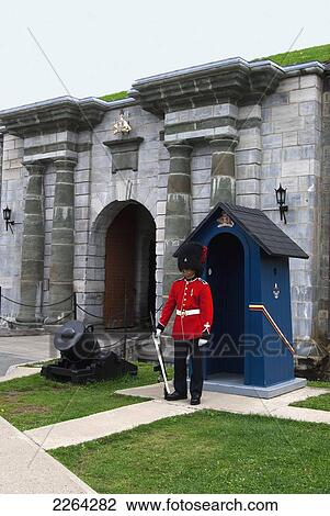 Stock Image - Military guard in full dress stands at attention by post at the citadelle; quebec city quebec canada. Fotosearch