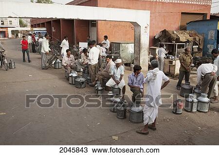Stock Image - Milk Vendors In The Early Morning, Jaipur, Rajasthan, India. Fotosearch