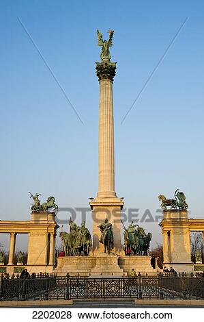 Stock Photo - Millenary Monument Consisting Of The Seven Tribes That Founded Hungary In The 9Th Century, And The Statue Of The Archangel Gabriel, That Holds The Holy Crown Of St. Stephen, Heroes Square, Budapest, Hungary. Fotosearch