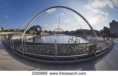 Millenium Bridge Over River Tyne And Sage Gateshead In The Distance; Newcastle, Tyne And Wear, England View Large Photo Image Stock Photo - Millenium Bridge Over River Tyne And Sage Gateshead In The Distance; Newcastle, Tyne And Wear, England. Fotosearch