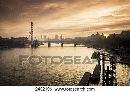 Stock Photography - Millenium Wheel with Big Ben in the skyline; London, England. Fotosearch