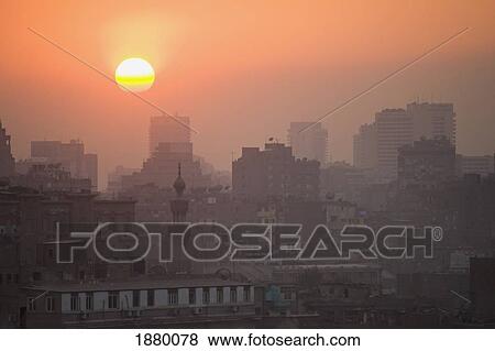 Stock Photo - Minaret And Blocks Of Flats At Dusk. Fotosearch
