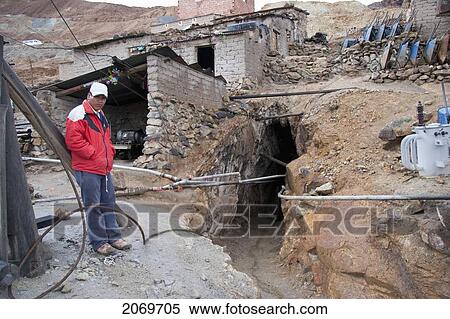 Stock Photography - Miner By A Shaft Of The Cerro Rico De Potos. Fotosearch