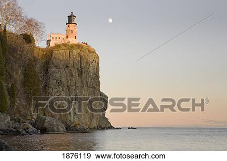 Stock Photo - Minnesota, United States Of America; Split Rock Lighthouse On The North Shores Of Lake Superior With A Full Moon In The Sky. Fotosearch
