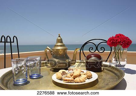Mint tea and cookies served at Kasbah Tabelkoukt; Morocco View Large Photo Image Stock Photo - Mint tea and cookies served at Kasbah Tabelkoukt; Morocco. Fotosearch