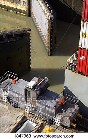 Stock Image - Miraflores Locks, Panama Canal, Panama, Central America; Container Ship In Lock. Fotosearch