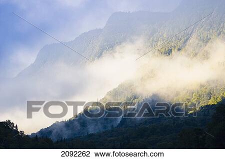 Stock Image - Mist On Jacques-Cartier River At Dawn In Jacques-Cartier National Park; Quebec Canada. Fotosearch