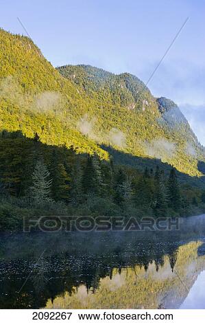 Stock Photo - Mist On Jacques-Cartier River At Dawn In Jacques-Cartier National Park; Quebec Canada. Fotosearch