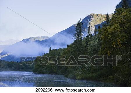 Stock Photograph - Mist On Jacques-Cartier River At Dawn In Jacques-Cartier National Park; Quebec Canada. Fotosearch