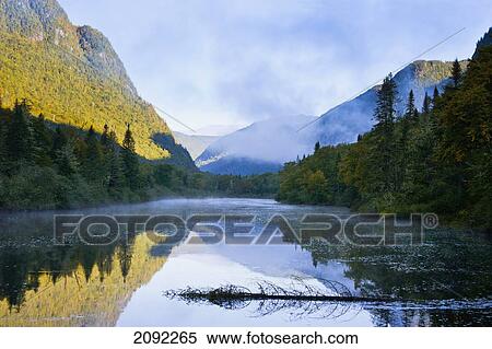 Stock Photography - Mist On Jacques-Cartier River At Dawn In Jacques-Cartier National Park; Quebec Canada. Fotosearch