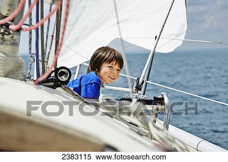 Mixed race 4-year-old boy sailing on Lake Ontario; Toronto, Ontario, Canada View Large Photo Image Stock Photography - Mixed race 4-year-old boy sailing on Lake Ontario; Toronto, Ontario, Canada. Fotosearch