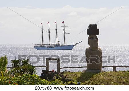 Stock Photo - Moai And The Four-Mast Barquentine, Esmeralda In Hanga Roa Harbour, Rapa Nui (Easter Island), Chile. Fotosearch