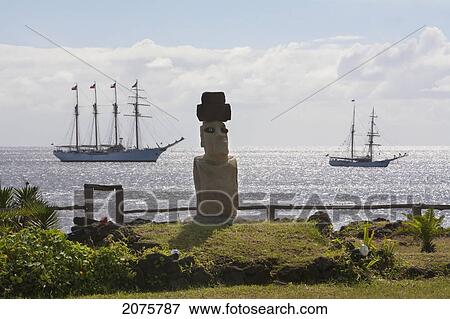 Stock Photo - Moai, The Four-Mast Barquentine, Esmeralda & Brigantine, Soren Larsen In Hanga Roa Harbour, Rapa Nui (Easter Island), Chile. Fotosearch