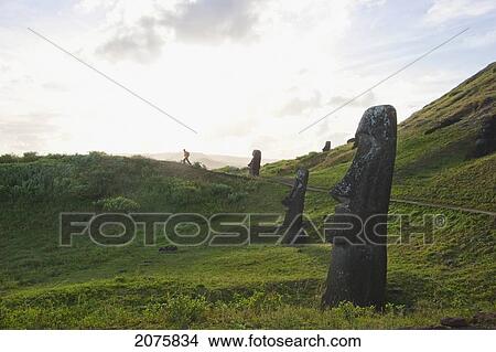 Moais By The Quarry On The Outer Slope Of The Rano Raraku Volcano, Rapa Nui (Easter Island), Chile View Large Photo Image Picture - Moais By The Quarry On The Outer Slope Of The Rano Raraku Volcano, Rapa Nui (Easter Island), Chile. Fotosearch