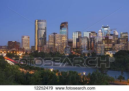 Modern North American city skyline at sunset; Calgary, Alberta, Canada View Large Photo Image Stock Photo - Modern North American city skyline at sunset; Calgary, Alberta, Canada. Fotosearch