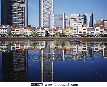 Stock Image - Modern Office Buildings And Traditional Houses. Fotosearch
