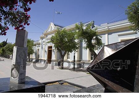 Stock Photo - Modern sculptures and Casa de Gobierno (Government House) on Avenida Mariano Moreno, Rawson, Chubut, Argentina. Fotosearch