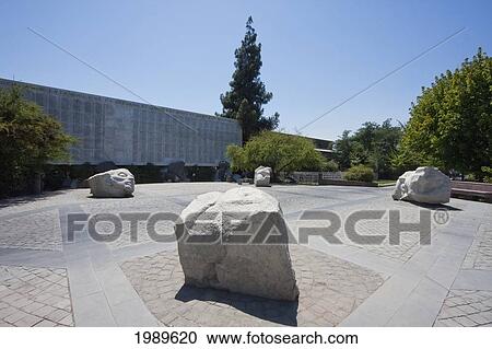 Modern sculptures in front of the Memorial Wall with the names of the victims of the Military Dictatorship (1973-1990) in the General cemetery, Santiago, Metropolitan Region, Chile View Large Photo Image Stock Image - Modern sculptures in front of the Memorial Wall with the names of the victims of the Military Dictatorship (1973-1990) in the General cemetery, Santiago, Metropolitan Region, Chile. Fotosearch