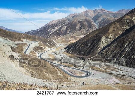Modern serpentine roads through old Tibetan mountains; Qinghai province, Tibet View Large Photo Image Stock Photo - Modern serpentine roads through old Tibetan mountains; Qinghai province, Tibet. Fotosearch