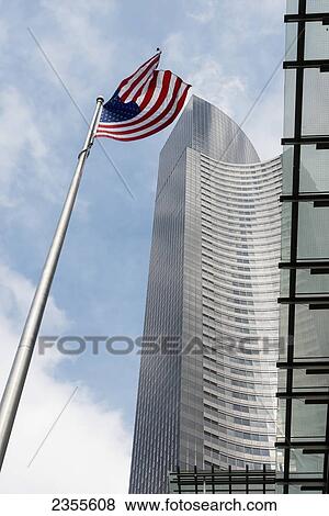 Stock Photo - Modern Skyscrapers And The American Flag; Seattle, Washington, United States Of America. Fotosearch