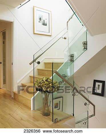 Stock Photograph - Modern stairwell with cream walls and wood floors; Victoria vancouver island british columbia. Fotosearch