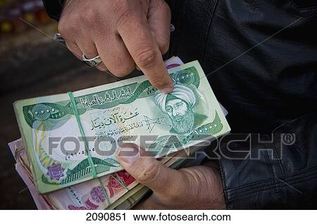 Money Changer Counting Money In The Street In Erbil, Iraqi Kurdistan, Iraq View Large Photo Image Stock Image - Money Changer Counting Money In The Street In Erbil, Iraqi Kurdistan, Iraq. Fotosearch