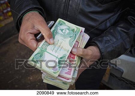 Money Changer Counting Money In The Street In Erbil, Iraqi Kurdistan, Iraq View Large Photo Image Stock Photo - Money Changer Counting Money In The Street In Erbil, Iraqi Kurdistan, Iraq. Fotosearch