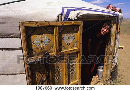 Mongolia, Traditional nomadic home and native woman standing in doorway; Ger Ranch View Large Photo Image Stock Image - Mongolia, Traditional nomadic home and native woman standing in doorway; Ger Ranch. Fotosearch