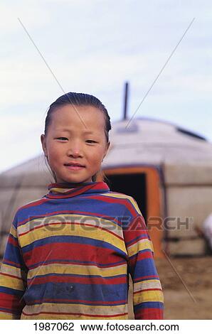 Mongolia, Young local girl standing in front of traditional nomadic home; Ger Ranch View Large Photo Image Stock Image - Mongolia, Young local girl standing in front of traditional nomadic home; Ger Ranch. Fotosearch