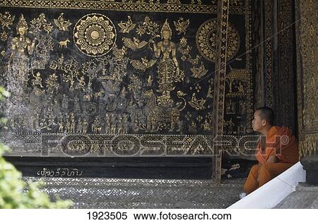 Stock Photography - Monk And Mural At Wat Xieng Thong. Fotosearch