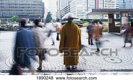 Monk And Pedestrians Outside Shinjuku Station, Blurred Motion View Large Photo Image Stock Photo - Monk And Pedestrians Outside Shinjuku Station, Blurred Motion. Fotosearch