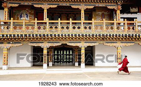 Monk Walking In Front Of Dzong, Punakha, Bhutan View Large Photo Image Stock Image - Monk Walking In Front Of Dzong, Punakha, Bhutan. Fotosearch