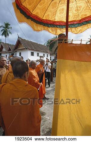 Monks Arriving At Wat Xieng Thong View Large Photo Image Picture - Monks Arriving At Wat Xieng Thong. Fotosearch